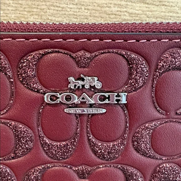 Coach Maroon Poppy Embossed Wristlet - Picture 2 of 7